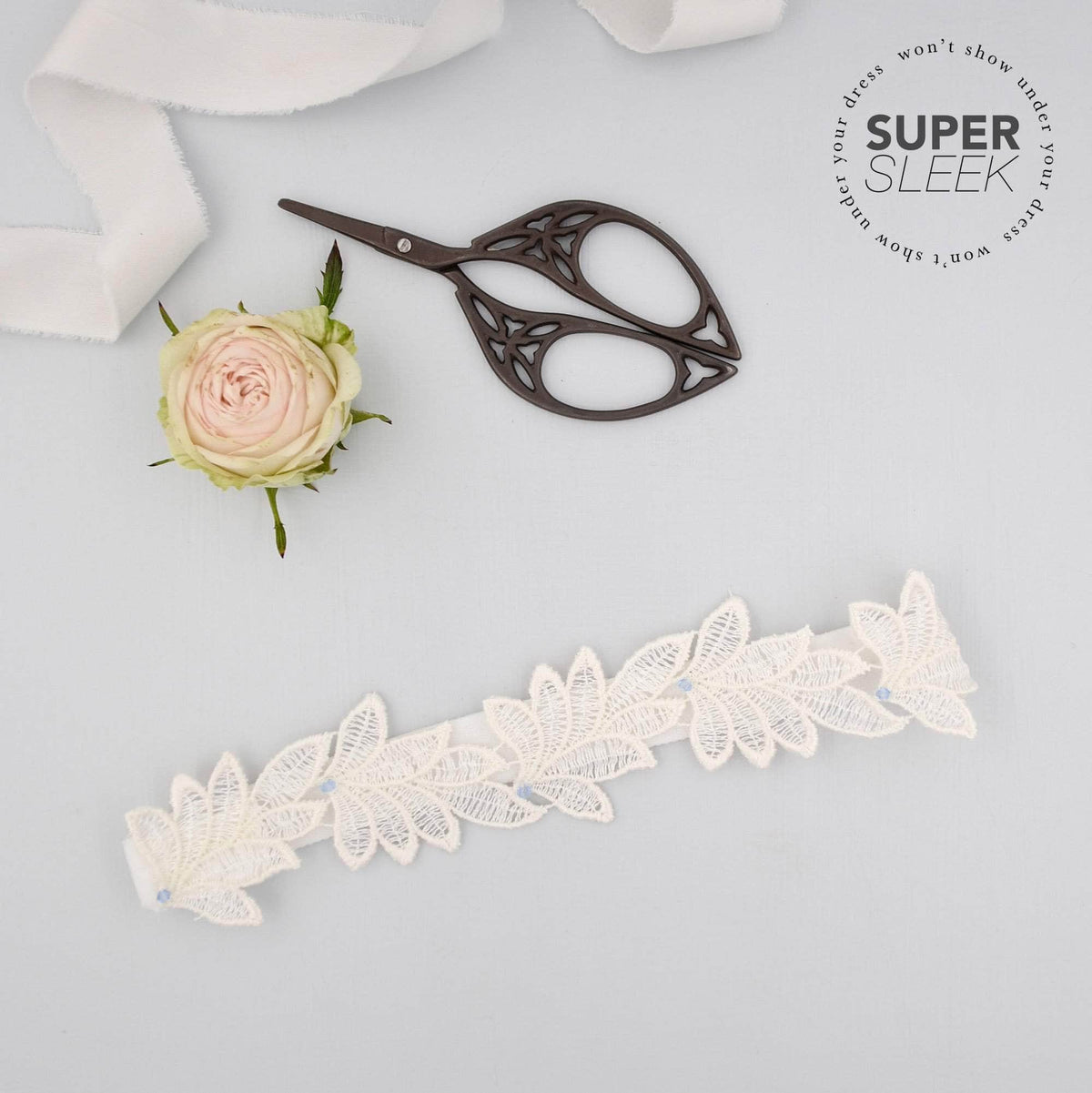 Wedding Garter Super sleek lace leaf wedding garter with &#39;something blue&#39; crystals - &#39;Elme&#39;