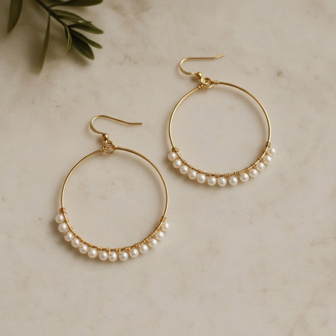 Gold hoop earrings with small freshwater pearls, handcrafted bridal jewellery by Britten Weddings.
