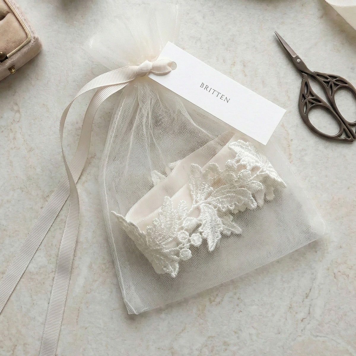 lace wedding garter in tulle dust bag