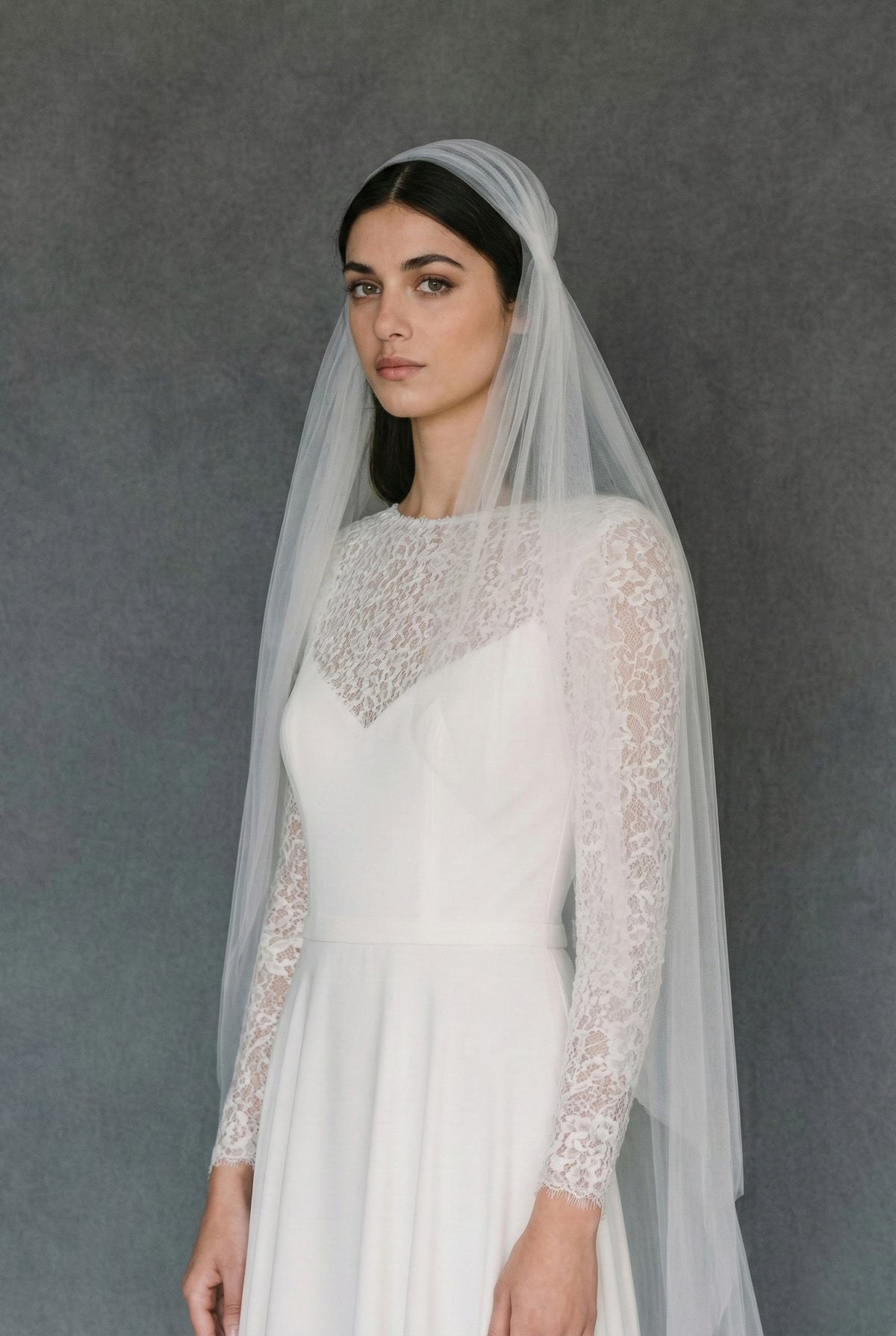 Two-tier Juliet cap wedding veil made of soft tulle with a simple cut edge finish