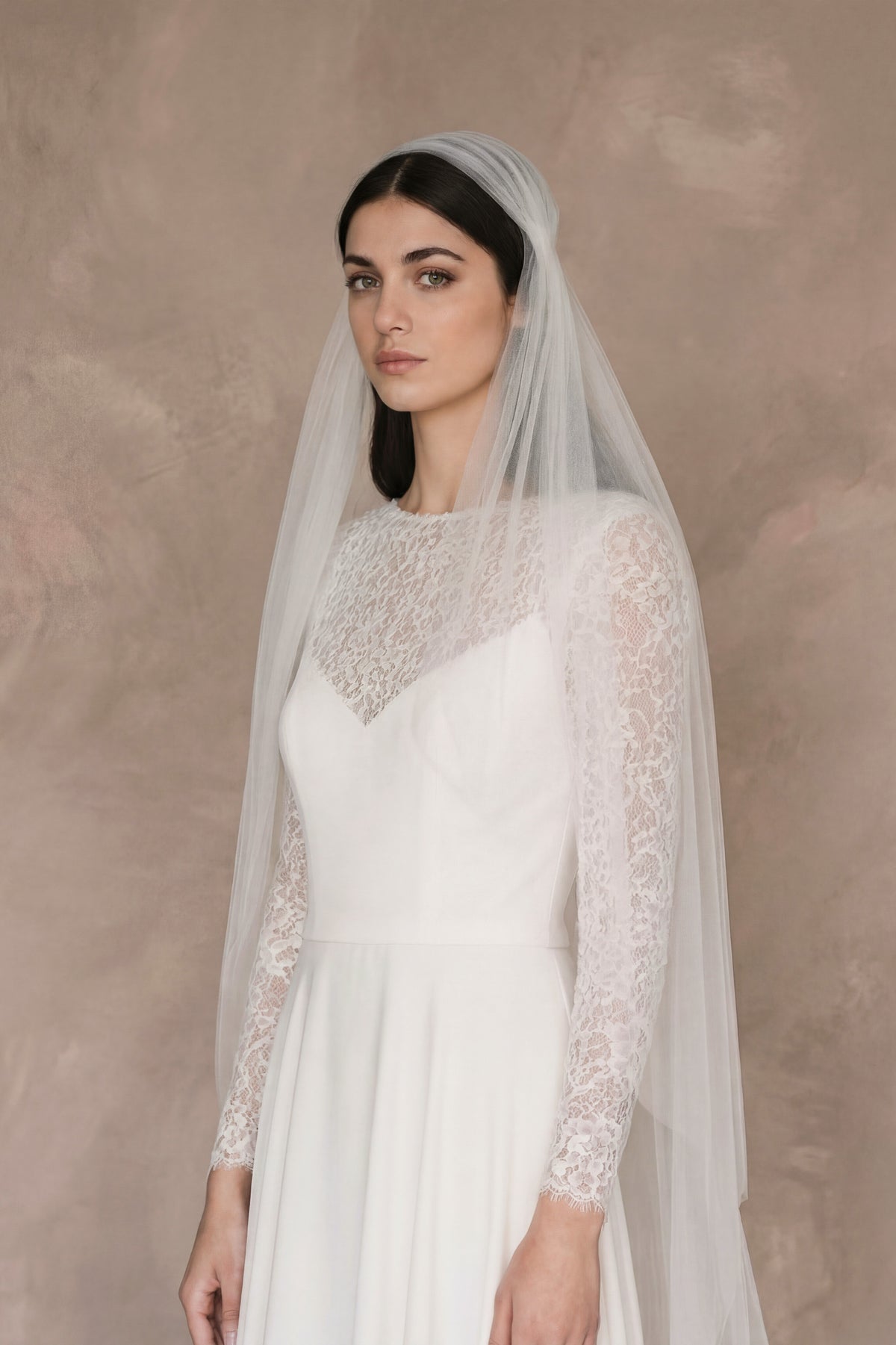 Two-tier Juliet cap wedding veil made of soft tulle with a simple cut edge finish