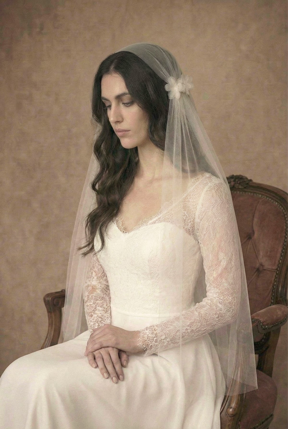 Bride wearing the Elowen silk-style Juliet cap wedding veil with pearl-centred tulle flowers