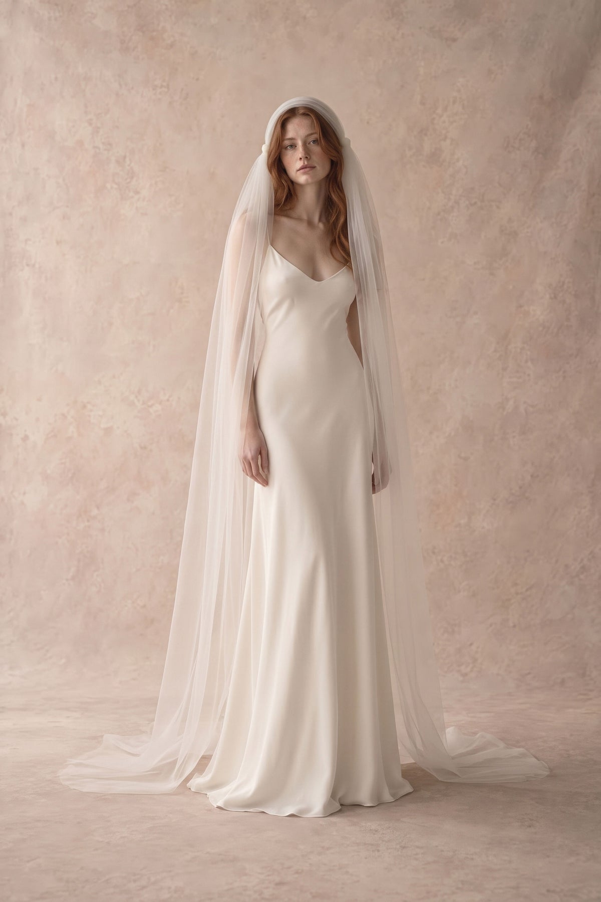 Rosaline knotted Juliet cap veil in cathedral length, pooling on the floor behind the bride