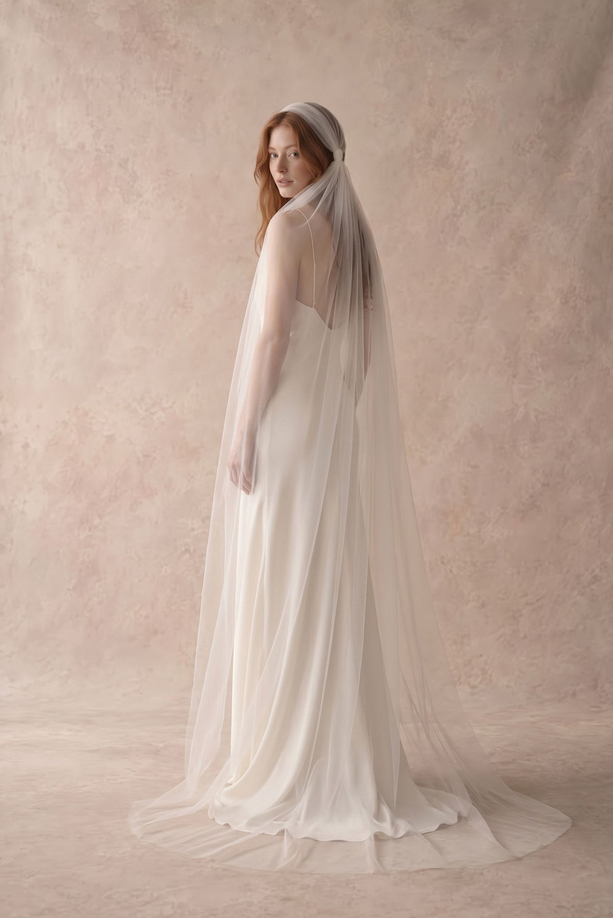 Bride wearing the Rosaline knotted Juliet cap veil in soft Italian tulle, floor length, with a silk slip wedding dress