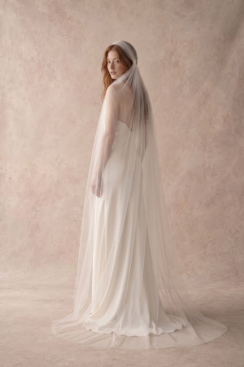 Bride wearing the Rosaline knotted Juliet cap veil in soft Italian tulle, floor length, with a silk slip wedding dress