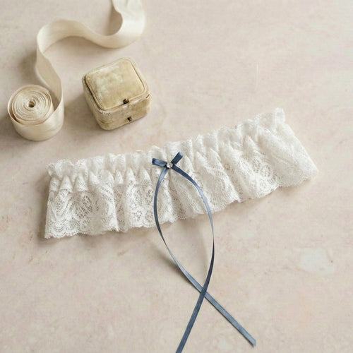 ivory lace wedding garter with blue bow