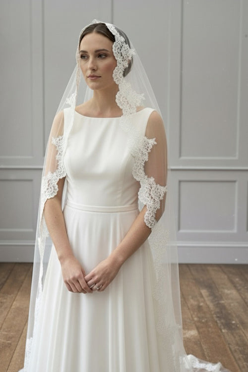 Bride wearing a mantilla wedding veil