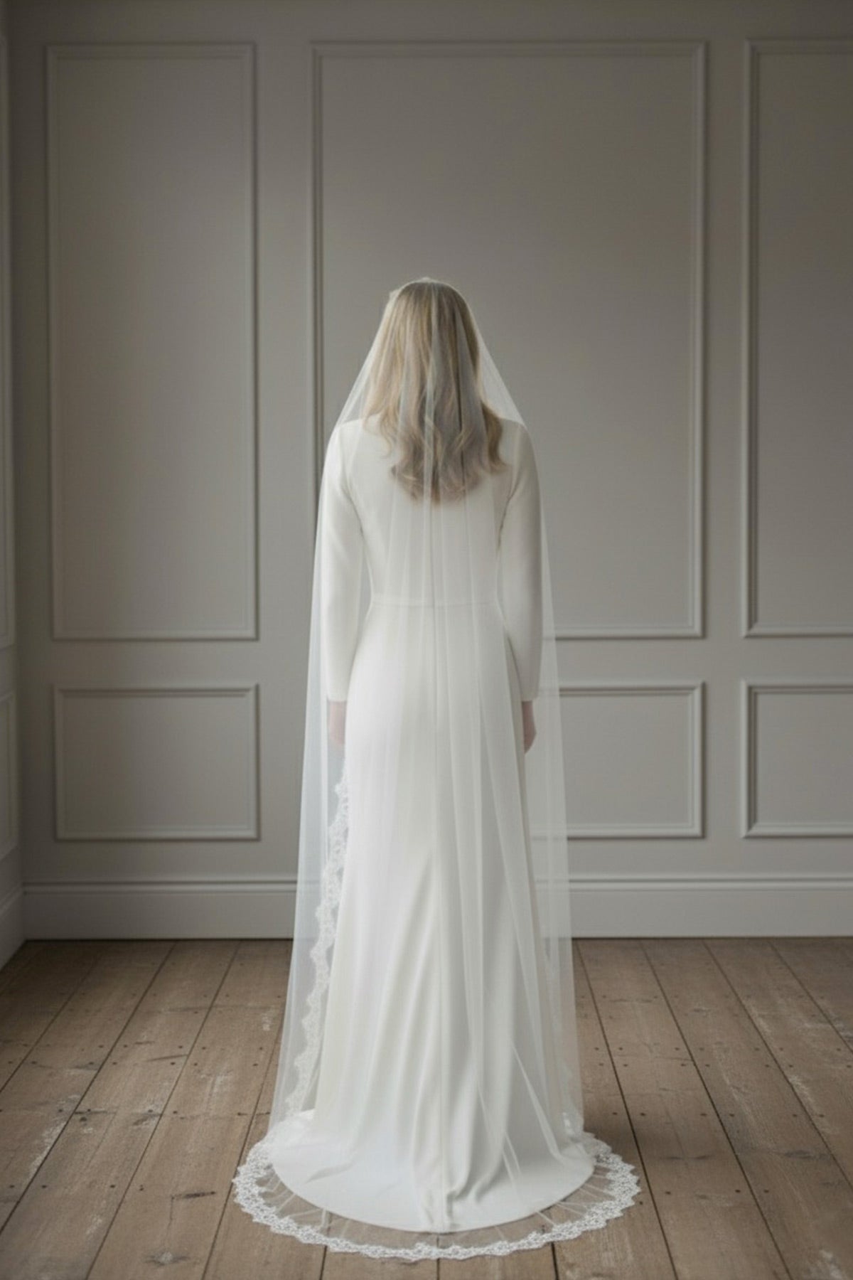 Back view of a Spanish-inspired mantilla veil in soft silk-style tulle with a French eyelash lace trim, handcrafted in England by Britten Weddings