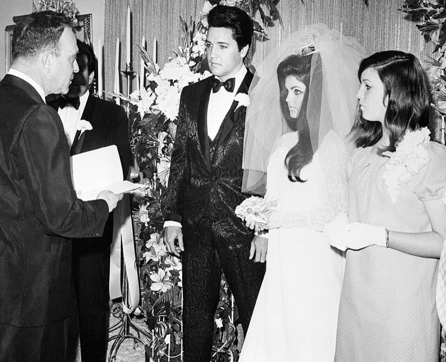 Priscilla Presley at her 1967 Las Vegas wedding to Elvis, wearing a crown headpiece with a voluminous tulle veil